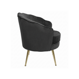 Black armchair with gold legs on a white background